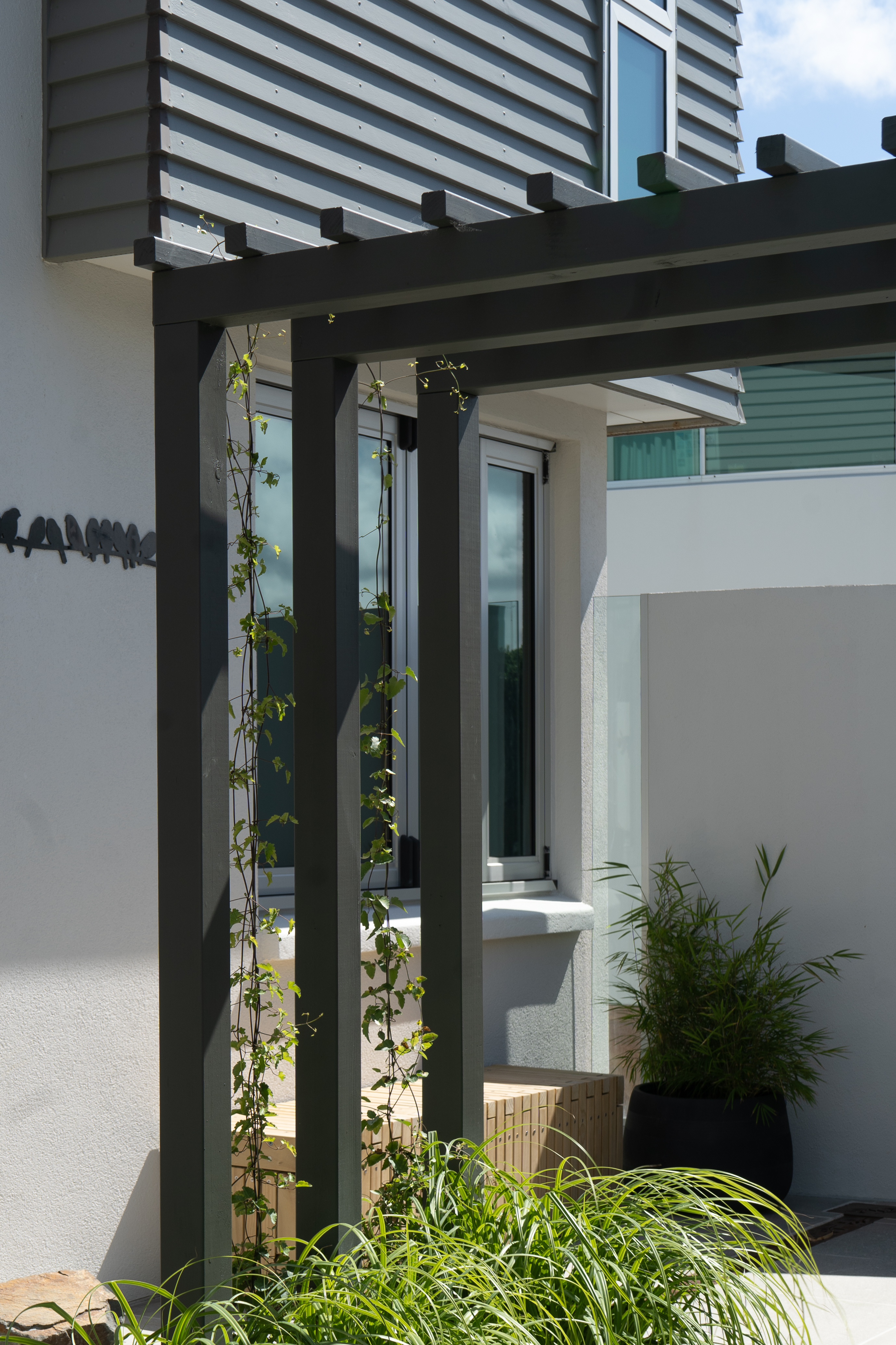 Close-up of the retaining wall and timber features.