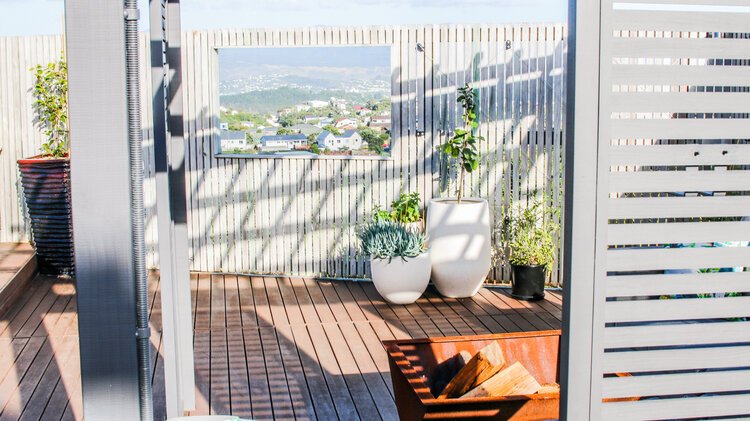 Detail of the adjustable privacy screens on the pergola.