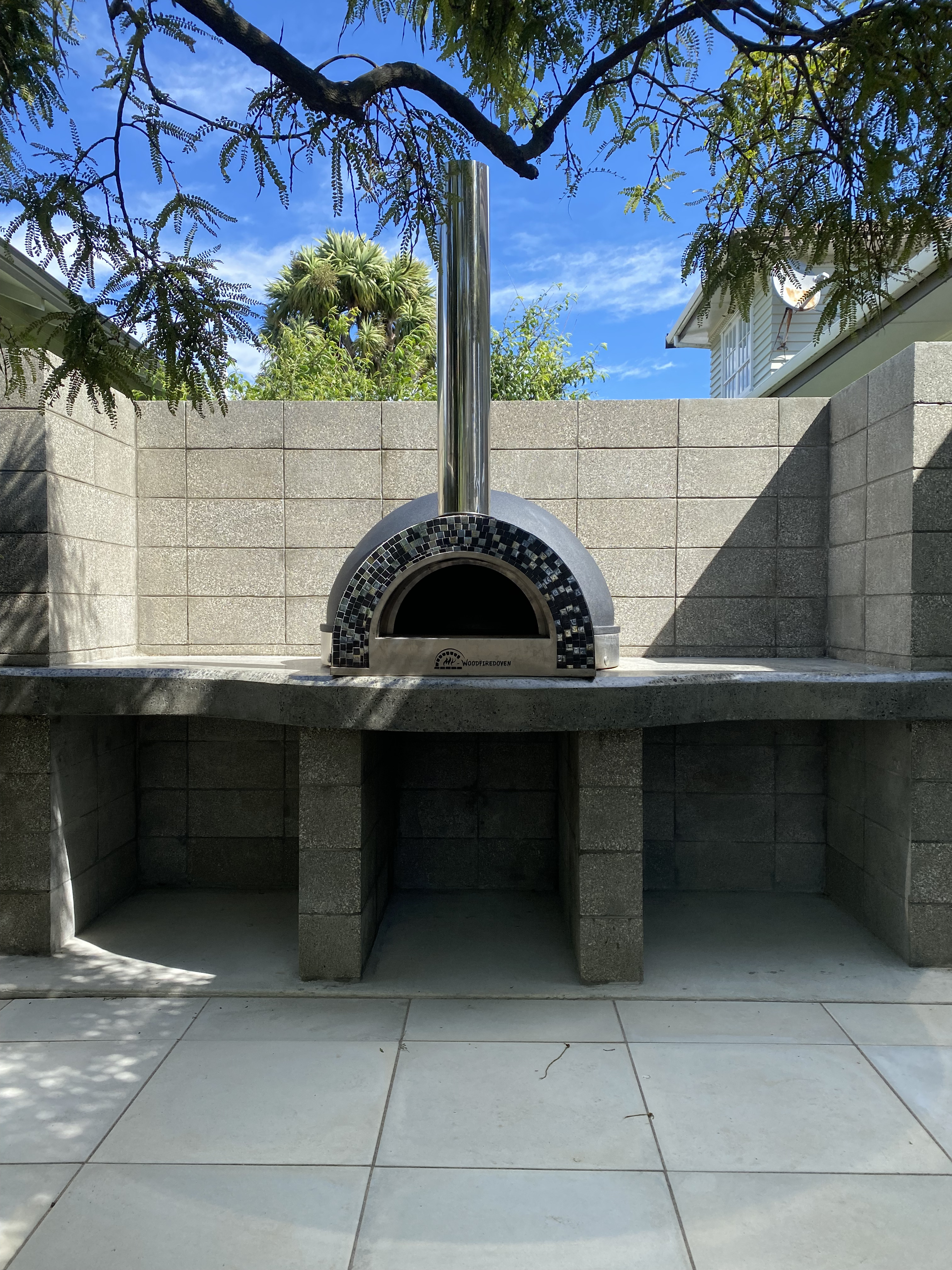 Modern patio with black woven furniture