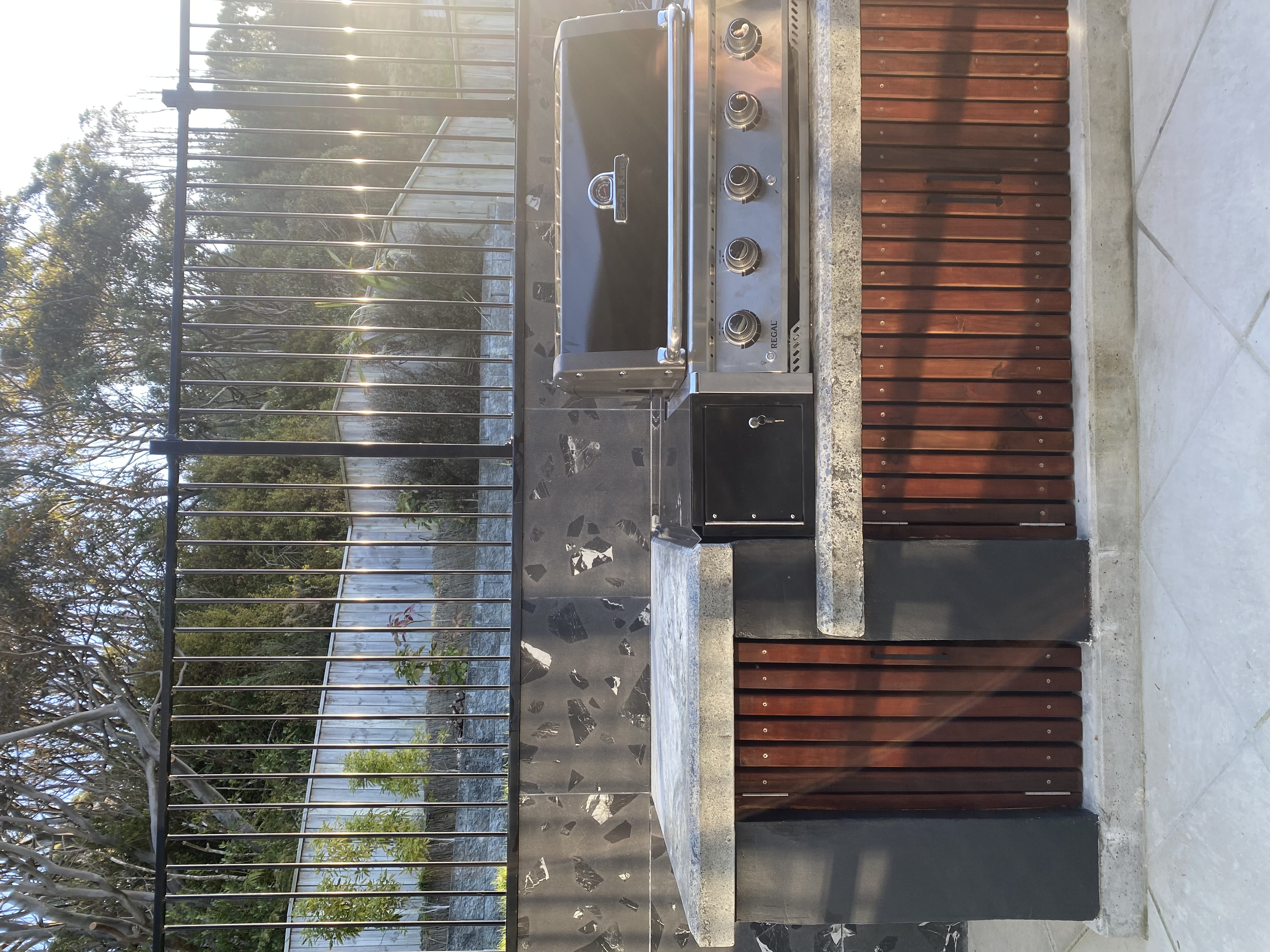 View of the motorised louvre roof providing shade over the patio